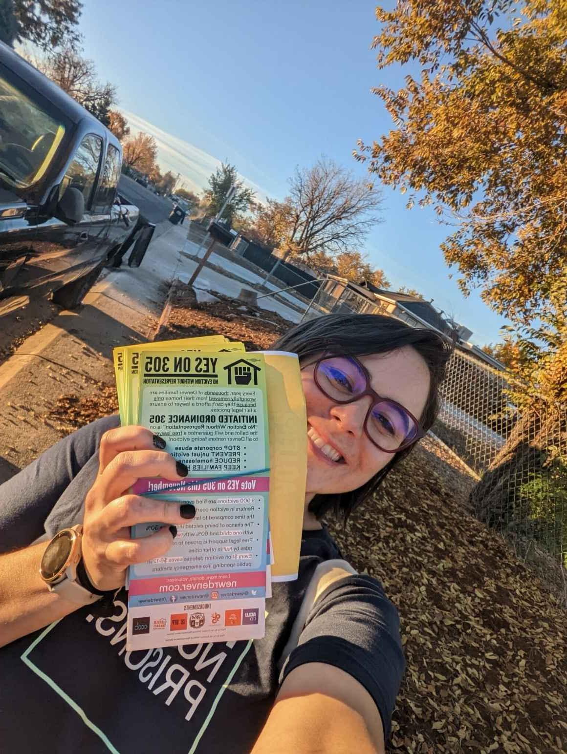 Organizer holding canvassing resources outdoors